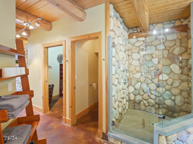 bathroom featuring beam ceiling, concrete floors, and wood ceiling