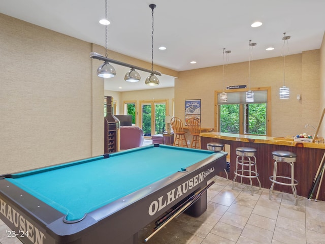 rec room with french doors, pool table, and indoor bar