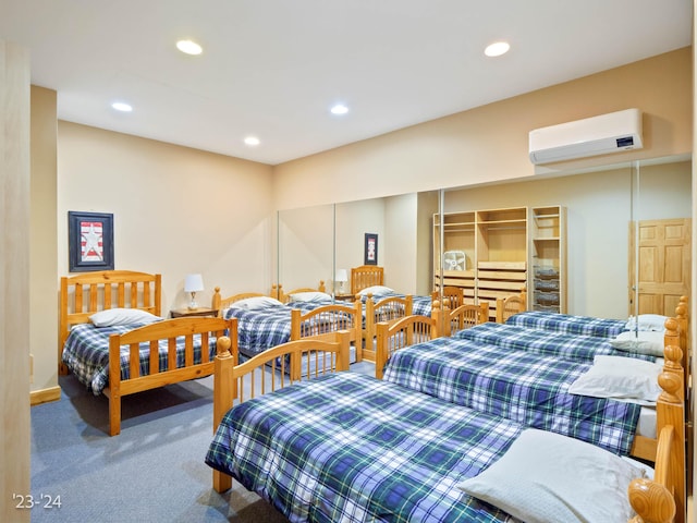 bedroom with carpet flooring and an AC wall unit