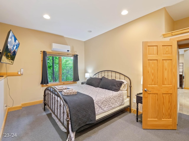 carpeted bedroom with an AC wall unit