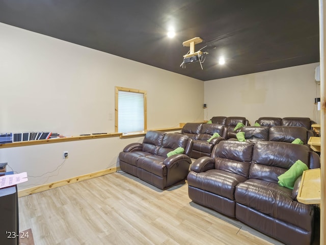 home theater room featuring light hardwood / wood-style floors