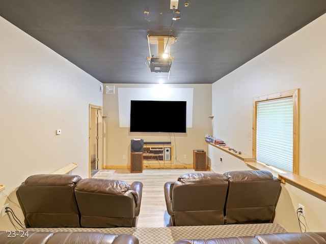 cinema room featuring wood-type flooring