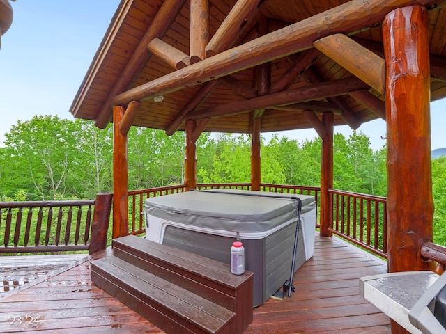 wooden terrace with a hot tub