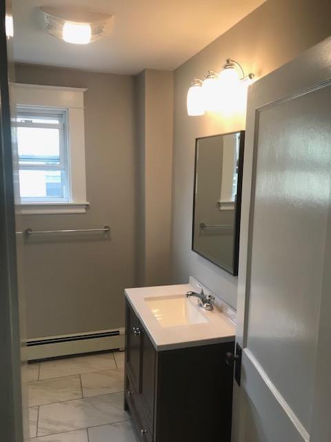 bathroom featuring a baseboard radiator and vanity