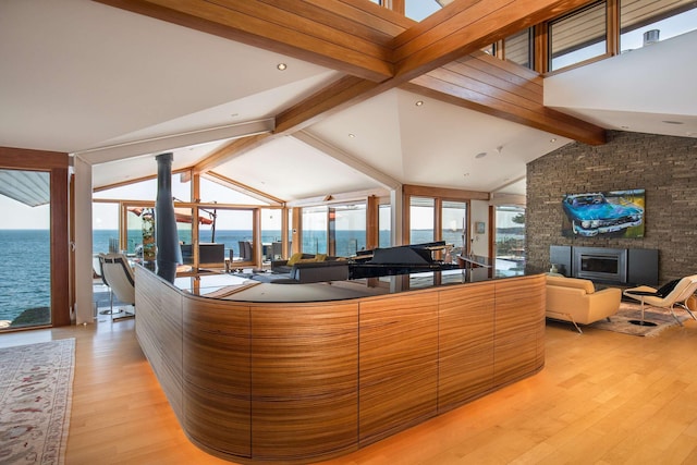reception area with a water view and a fireplace