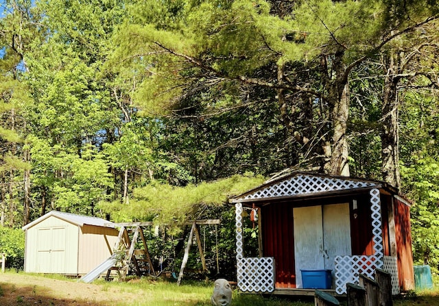 view of shed featuring a forest view