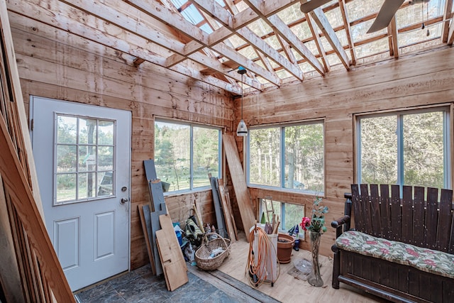 sunroom / solarium featuring ceiling fan