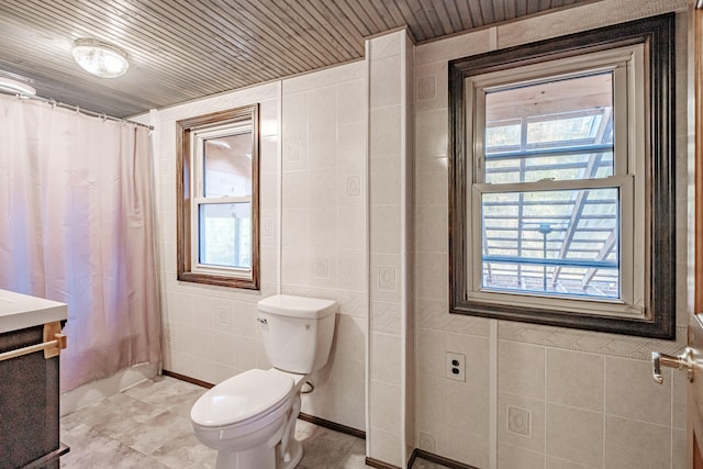 bathroom with wood ceiling, toilet, walk in shower, and tile walls