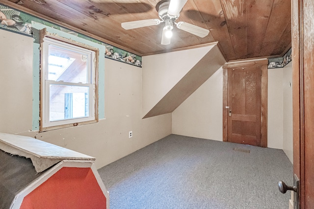 additional living space with carpet, ceiling fan, and wood ceiling