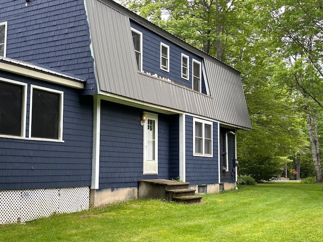 rear view of house with a yard