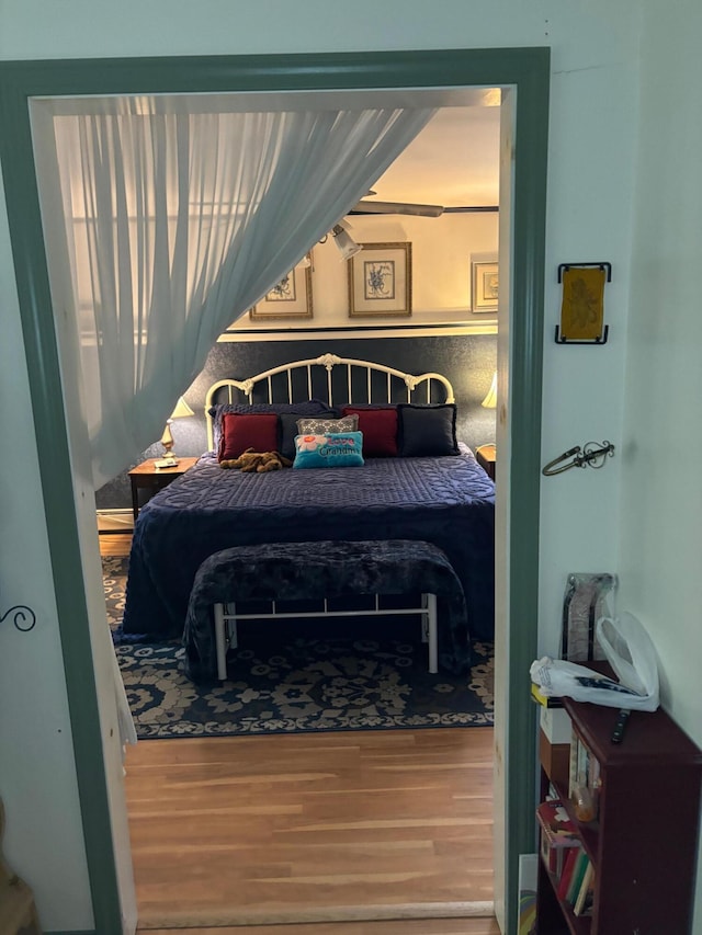 bedroom with wood-type flooring