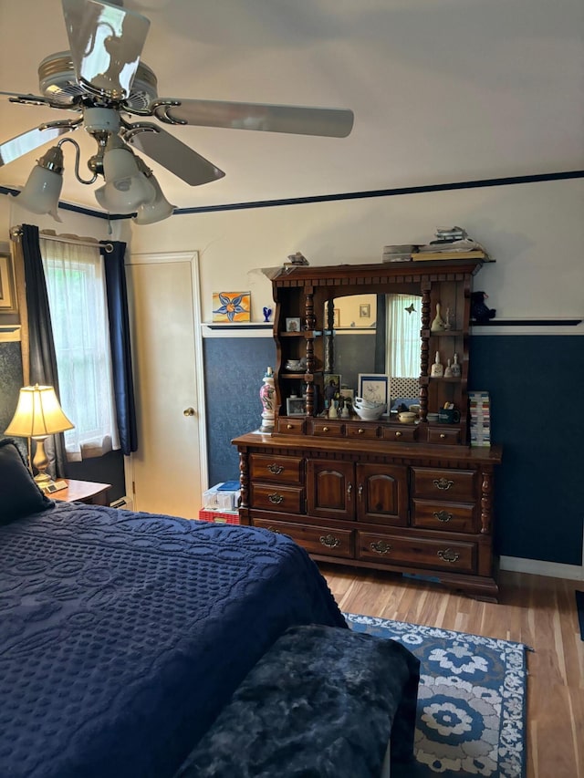 bedroom featuring ceiling fan and light wood-type flooring