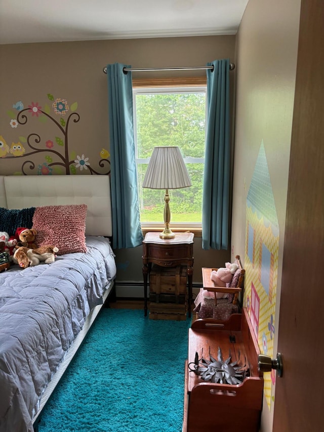 bedroom featuring dark carpet and baseboard heating