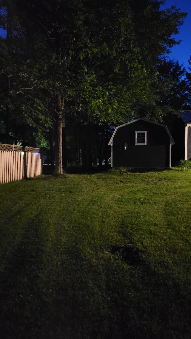 view of yard at twilight