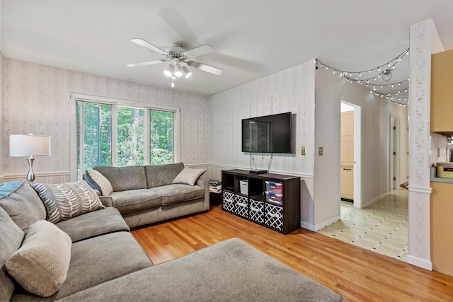 living room with hardwood / wood-style flooring and ceiling fan