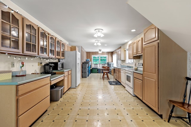 kitchen featuring sink and white appliances