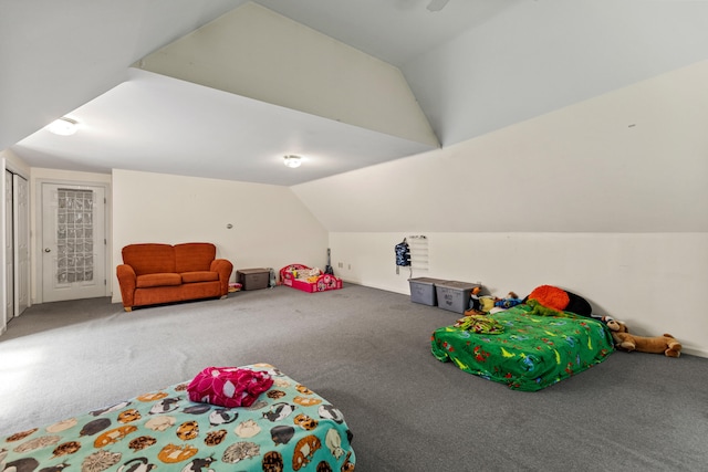 bedroom with carpet and vaulted ceiling