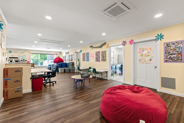 interior space featuring crown molding and dark wood-type flooring