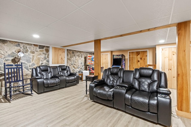 living room with light wood-type flooring and a drop ceiling