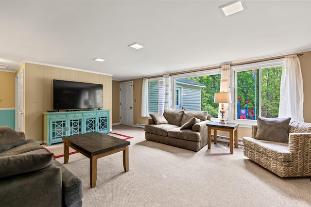 carpeted living room featuring crown molding and baseboard heating