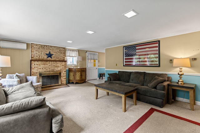 carpeted living room featuring a wall unit AC, ornamental molding, and a brick fireplace