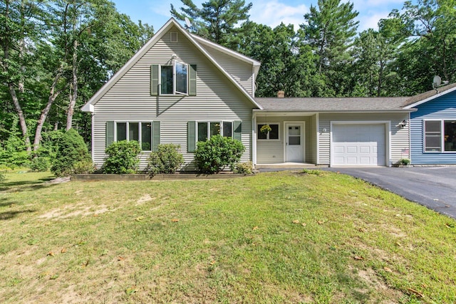 view of front facade with a garage and a front yard