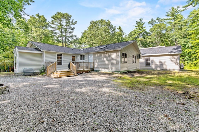 back of property featuring a deck