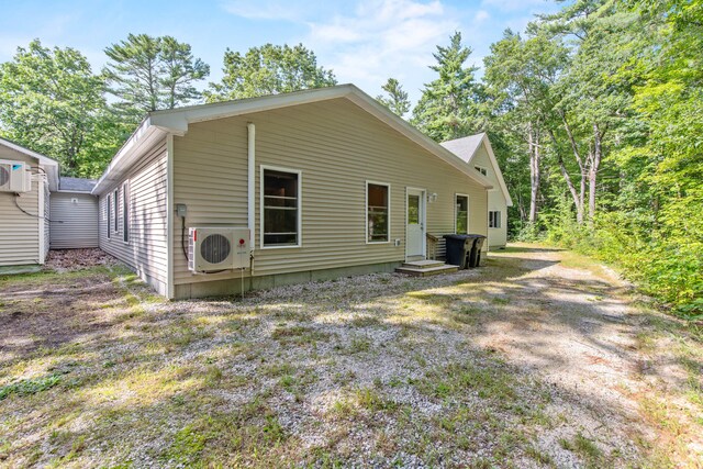 back of property featuring ac unit