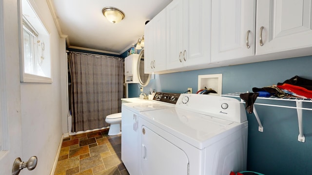 laundry area featuring washing machine and dryer and ornamental molding