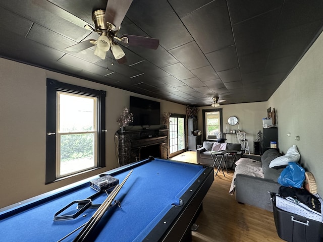 playroom featuring dark hardwood / wood-style flooring, ceiling fan, pool table, and a healthy amount of sunlight