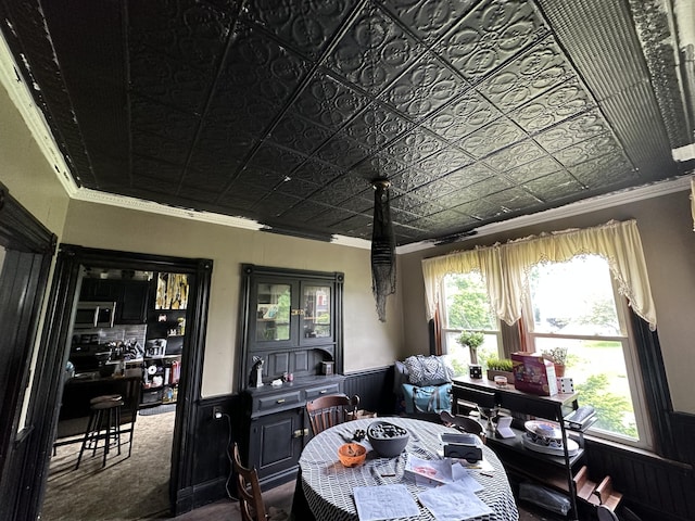 dining space featuring crown molding and a wealth of natural light