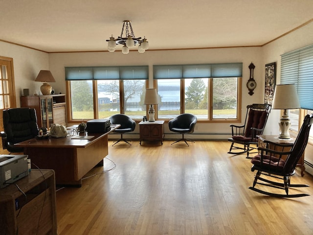 office space featuring an inviting chandelier, ornamental molding, and light hardwood / wood-style flooring