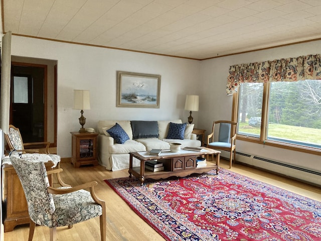 living room featuring ornamental molding, light hardwood / wood-style floors, and a baseboard radiator