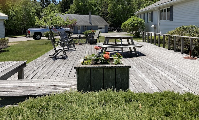 wooden terrace with a yard