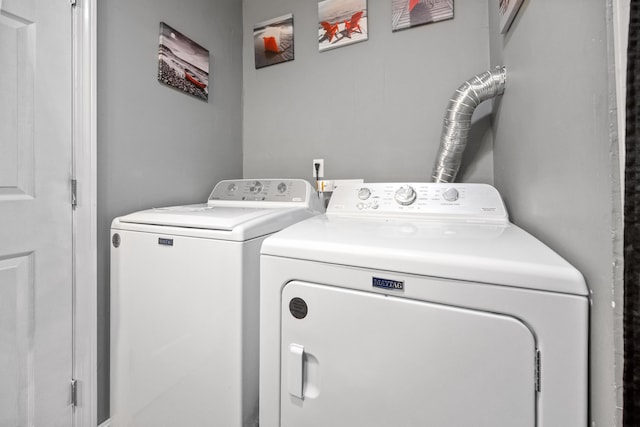 laundry room with independent washer and dryer