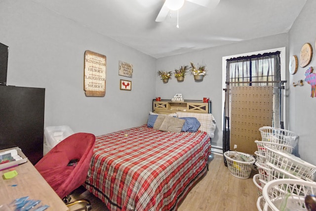 bedroom featuring ceiling fan and hardwood / wood-style flooring