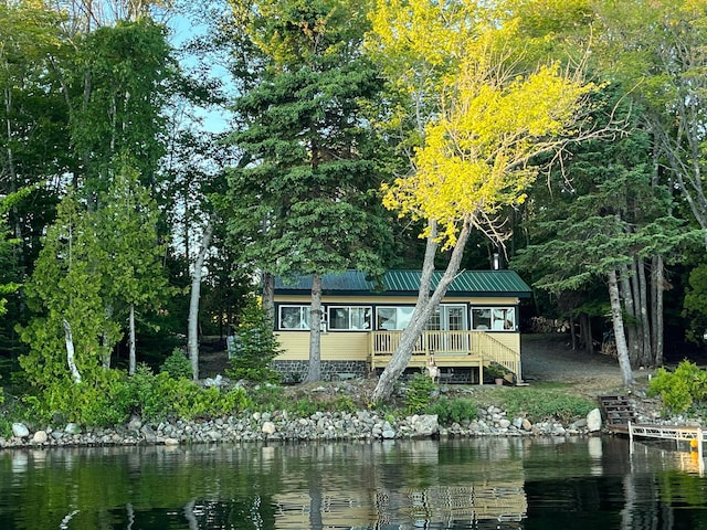 back of house with a water view