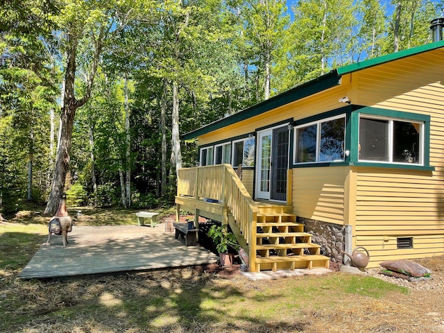 exterior space featuring a wooden deck