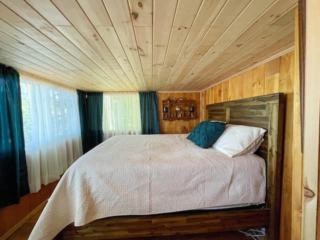 bedroom with wood walls and wood ceiling