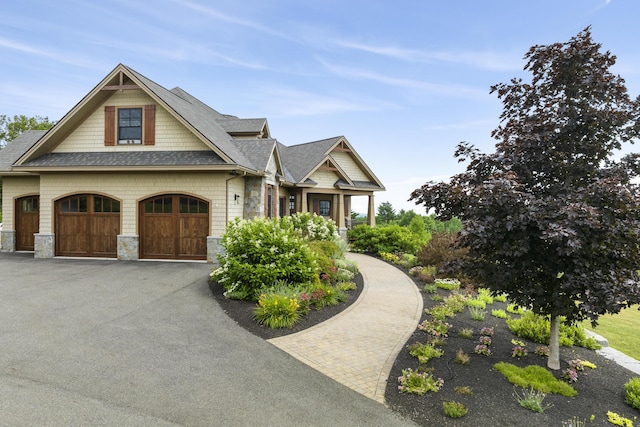 craftsman inspired home with a garage