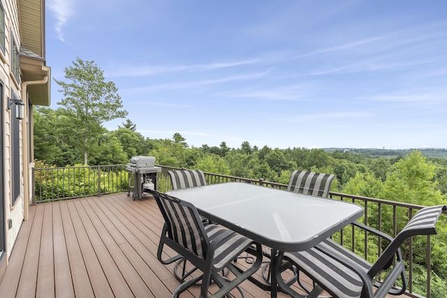 wooden terrace featuring area for grilling