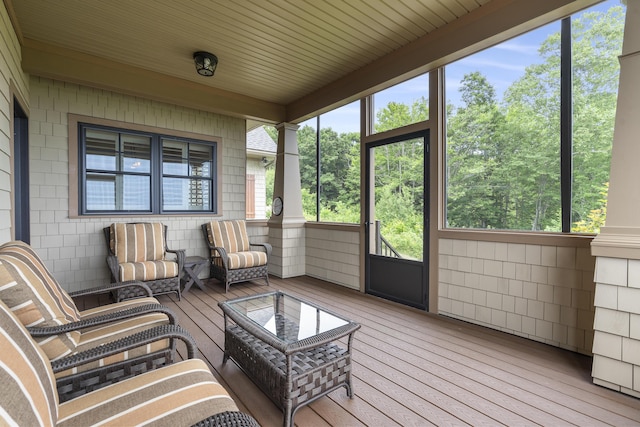 sunroom featuring wood ceiling