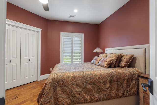 bedroom featuring ceiling fan, a closet, and light hardwood / wood-style floors