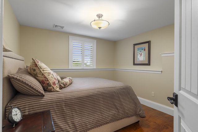 bedroom featuring dark wood-type flooring