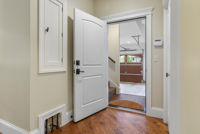 doorway to outside featuring wood-type flooring