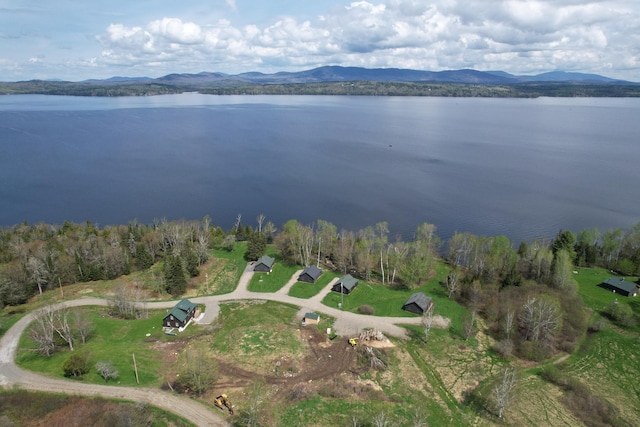 bird's eye view with a water and mountain view