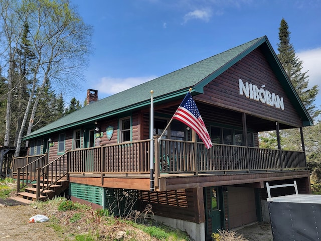 back of property featuring a garage