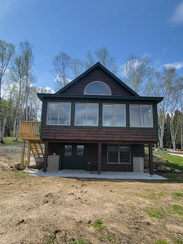 rear view of house with a deck