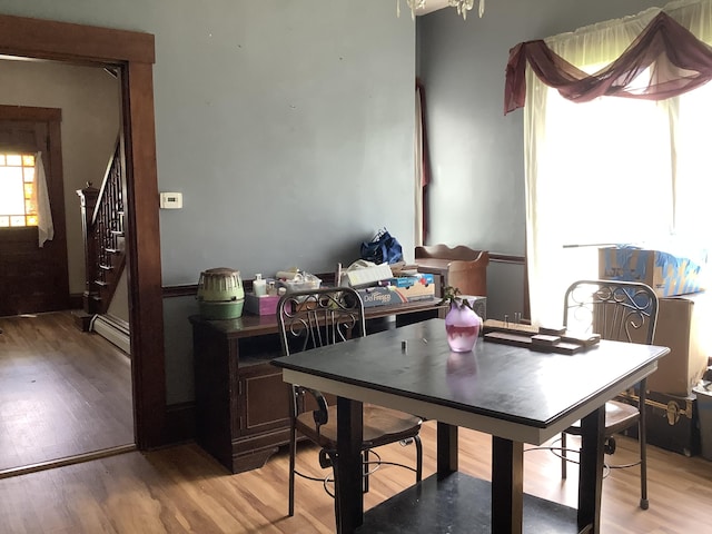 dining room featuring light hardwood / wood-style flooring and a baseboard heating unit