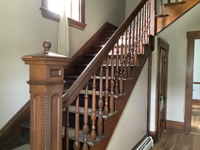 stairway featuring hardwood / wood-style floors